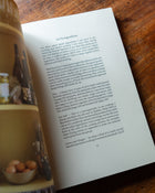 'Midweek Recipes' by Jess Elliott Dennison book opened to show inside.