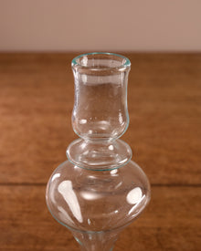 Clear glass vase on a wooden surface