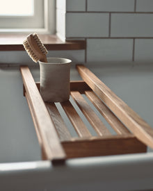 Toothbrush holder on a bath rack
